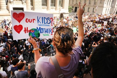 People march to demand action on the global climate crisis on September 20, 2019 in New York City. In what could be the largest climate protest in history and inspired by the teenage Swedish activist Greta Thunberg, people around the world are taking to the streets to demand action to combat climate change.