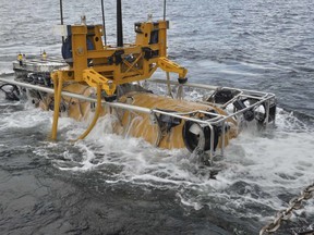 A launch and recovery system recovers the remotely operated pressurized rescue module from the water following an unmanned training dive in Ketchikan, Alaska.