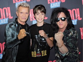 Billy Idol and bandmate Steve Stevens posed with 12-year-old Nico Boffo before Idol's concert on Saturday night at the PNE. Photo: Craig Hodge/PNE