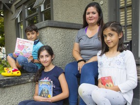 Melissa Arancibia from Chile is a parent attending Canucks Family Education Centre programs to learn English. She is shown here with three of the 10 children she and her husband Victor have in their blended family, Maximo Vazquez (from left), Nirvana Vazquez and Pia Vazquez.