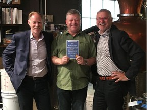 Graeme Menzies (left) and Dave Doroghy (right) are the authors of 111 Places in Vancouver That You Must Not Miss. They are show here with Charles Tremewen of Longtable Distillery.
