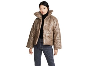 A model wears a snake-print, faux-leather jacket from the brand Nanushka. $918 | Shopbop.com