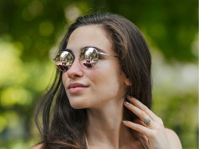 A model wears sunglasses from the Canadian brand Callula Co.