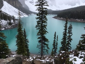 The brilliant colour of Moraine Lake near Lake Louise is enhanced by a pre-summer snowfall.