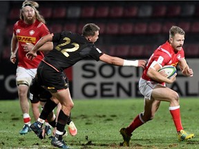 Canada's centre Conor Trainor escapes a tackle during the 2019 Japan Rugby Union World Cup qualifying match between Canada and Germany at the Delort Stadium on November 17, 2018 in Marseille, southern France.