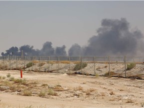 Smoke billows from an Aramco oil facility in Abqaiq about 60km (37 miles) southwest of Dhahran in Saudi Arabia's eastern province on September 14, 2019. - Drone attacks sparked fires at two Saudi Aramco oil facilities early today, the interior ministry said, in the latest assault on the state-owned energy giant as it prepares for a much-anticipated stock listing. Yemen's Iran-aligned Huthi rebels claimed the drone attacks, according to the group's Al-Masirah television.