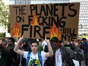 FILE PHOTO: People gather during the Global Climate Strike march at Foley Square in New York September 20, 2019.