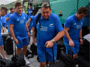 New Zealand head coach Steve Hansen, second from right, arrives with the team at the hotel in Beppu on Sept. 24. ahead of their next match at the 2019 Rugby World Cup against Canada.