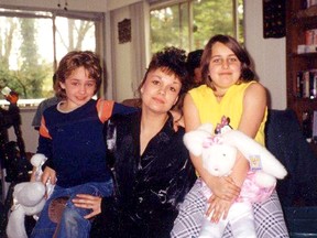 Angel Fehr with her two daughters in an undated photo. Trent Larsen, 52, was charged earlier this month with the May 2000 murder of 27-year-old Fehr, who was five months pregnant.