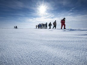 Hoarfrost covers the snow where researchers cross a lagoon in Utqiagvik, Alaska, on April 9, 2019. The researchers are among a group gathered to prepare for the year-long MOSAiC expedition that will collect data on Arctic climate and ecosystems.