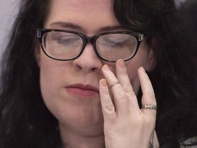 Julia Lamb, who has a degenerative muscle disease, pauses during a news conference in Vancouver, B.C., Monday, June, 27, 2016.