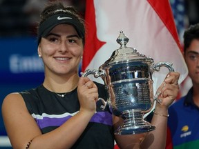 Mississauga native Bianca Andreescu shows off her trophy after winning the U.S. Open. GETTY IMAGES
