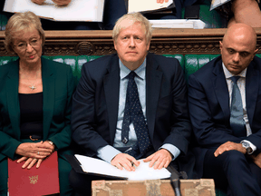 Britain's Prime Minister Boris Johnson flanked by Business Secretary Andrea Leadsom, left, and Chancellor of the Exchequer Sajid Javid in the House of Commons in London on Sept. 3, 2019.