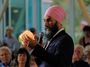 This is an edited photo illustration of Jagmeet Singh holding a burger.