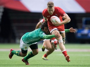 Conor Trainor of Vancouver powers past the tackle of Brazil's Lucas Duque in World Rugby Sevens Series' Canada action in Vancouver in 2016.