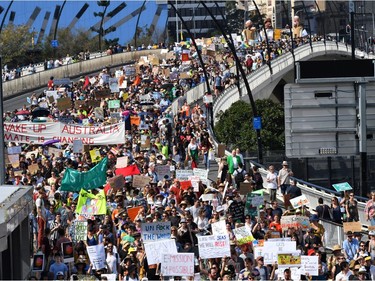 Climate change protesters are seen crossing the Victoria Bridge during the Global Strike 4 Climate rally in Brisbane, Australia, September 20, 2019.