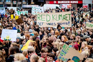 People hold placards during the Global Climate Strike at Raadhuspladsen in Copenhagen, Denmark September 20, 2019.