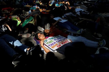 Students and activists hold placards with messages as they participate in a Global Climate Strike rally in New Delhi, India, September 20, 2019.