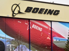 Boeing Co's logo is seen above the front doors of its largest jetliner factory in Everett, Washington, U.S. January 13, 2017.