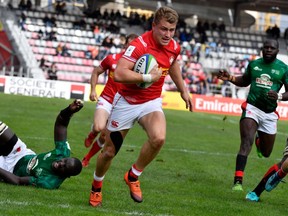 Canada's Theo Sauder runs to score a try during the 2019 Rugby Union World Cup qualifying match between Canada and Kenya at The Delort Stadium in Marseille on November 11, 2018.