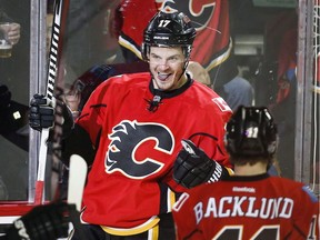 Calgary Flames' Lance Bouma celebrates his game-winning goal with teammates during third period NHL hockey action against the Edmonton Oilers in Calgary, Saturday, Jan. 31, 2015. Photo: Jeff McIntosh/CP