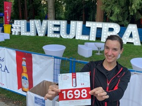 Marlies De Ceuster of North Vancouver shows off her 5K race bib on Friday in Stanley Park. She won the 30-39 female age division by posting a time of 24:35. She was also 21st overall in the Vancouver Ultra Night Run event, which attracted more than 1,100 participants.