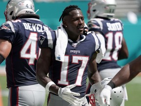 New England Patriots wide receiver Antonio Brown (17) watches from the sidelines in the second half against the Miami Dolphins  at Hard Rock Stadium. The Patriots defeated the Dolphins 43-0.