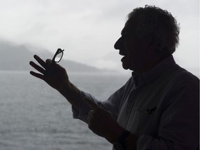Parviz Tanavoli shown in February, 2017 front of a picture window in his West Vancouver home overlooking Howe Sound. Photo: Gerry Kahrmann/PNG