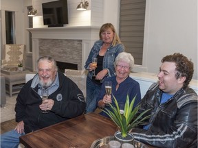 77 year old Albert Prendergast of Port Moody, the winner of the 2019 PNE Prize Home Grand Prize Package celebrates in the Home with his partner, Maureen Newell and daughter-in-law Laurie Newell and grandson Kyle Newell.