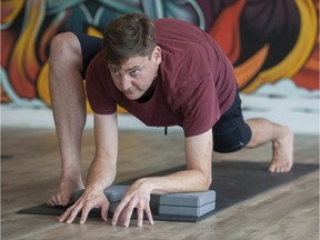 Attorney General David Eby takes time out from his busy schedule to attend a yoga class at The Hot Box Yoga in Vancouver. Photo: Jason Payne/Postmedia