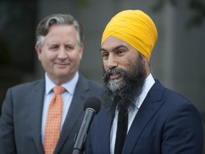 Federal NDP Leader Jagmeet Singh, right, meets with Vancouver Mayor Kennedy Stewart at Vancouver City Hall on Sept. 25.