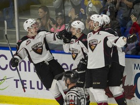 The 2018 edition of the Vancouver Giants celebrate Ty Ronning's playoff goal against the Victoria Royals at the Langley Event Centre on April 2, 2018.