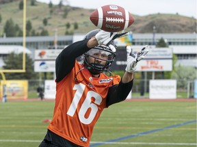 B.C. Lions receiver Bryan Burnham catches a football during training camp in Kamloops earlier this year. Photo: Richard Lam/Postmedia