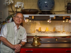 Wallace Chung with a model he built of the Empress of Japan and the original bell that was aboard the ship.