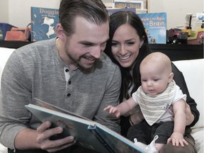 Vancouver Canucks forward Sven Baertschi with his wife Laura and their son Callan. Photo: Nick Procaylo/Postmedia