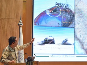 Saudi Colonel Turki bin Saleh al-Malki presents evidence during a press conference in Riyadh on Wednesday, following the weekend attacks on Saudi Aramco's facilities in Abqaiq and Khurais.