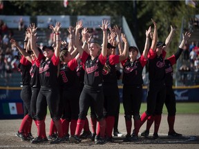 Canada teammates celebrate after defeating Brazil during playoff action at the Softball Americas Olympic Qualifier tournament in Surrey, B.C., on Sunday Sept. 1, 2019. With the win Canada qualifies for the 2020 Tokyo Olympics.