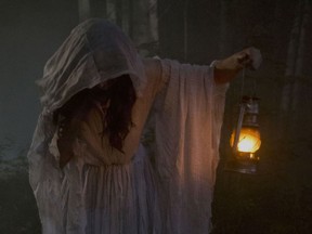 Mayko Nguyen as the Lady In White in Matthew Currie Holmes’s The Curse of Buckout Road.