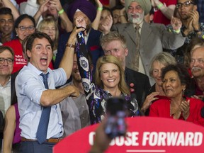 Prime Minister Justin Trudeau gestures to Liberal candidate Tamara Taggart at his first rally of the 2019 election campaign, held in the longtime NDP stronghold of Vancouver-Kingsway.