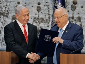 Israeli President Reuven Rivlin tasks Prime Minister Benjamin Netanyahu with forming a new government, during a press conference in Jerusalem on September 25, 2019.