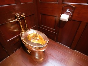 "America", a fully-working solid gold toilet, created by artist Maurizio Cattelan, is seen at Blenheim Palace on Sept. 12, 2019 in Woodstock, England.