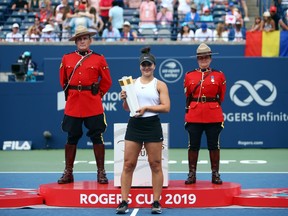 Bianca Andreescu of Canada with the winners trophy following her victory over Serena Williams of the United States in the final match on Day 9 of the Rogers Cup at Aviva Centre on August 11, 2019 in Toronto, Canada. Williams withdrew from the match with a back injury.