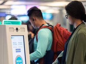 Vancouver International Airport will become the first airport in Canada to employ facial recognition technology. The automated kiosks for Nexus cardholders — those who are screened and pay a fee to receive a Nexus card for expedited boarding and customs crossings — will download and store the cardholder's passport photo. Two unidentified travellers are shown with the new kiosks.
