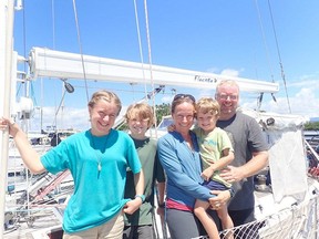 The Shaw family (from left to right: Victoria, Johnathan, Elizabeth, Benjamin and Max) pose on the SV Fluenta before heading to the Marshall Islands in December 2018.