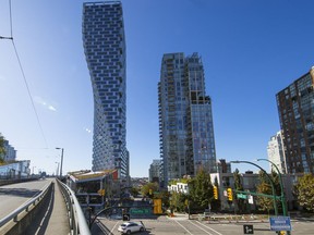 Vancouver House is a 60-storey condo tower designed by Bjarke Ingels Group for Westbank Corp. The tower expands from a triangular base to a rectangle. It's on the left next to the Granville Street Bridge.