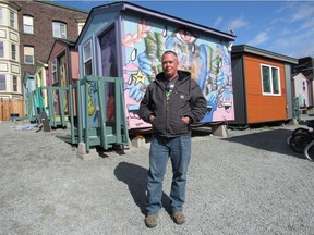 ric Pattin lives in a tent in Camp Second Chance, a City of Seattle-sanctioned homeless encampment. He is pictured at True Hope Village, where he works. True Hope Village is one of Seattle's tiny home villages, home to formerly homeless Seattleites, including families with children.