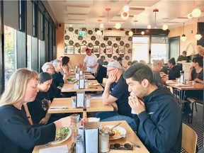 Douce Diner and owner Dawn Doucette (at the rear table in red head scarf).