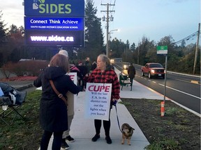 Support staff at SIDES distance education on Wilkinson Road join with support staff at 18 other sites in Saanich Monday morning to walk the picket line for higher wages.