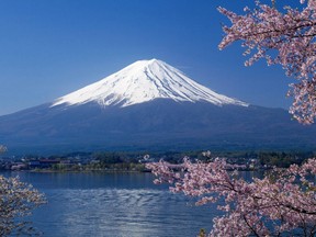 This picture taken in April, 2012 shows Japan's highest peak Mount Fuji, seen behind Lake Kawaguchi in Yamanashi prefecture.