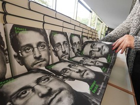Copies of the book titled "Permanent Record" by US former CIA employee and whistleblower Edward Snowden are for sale on the sidelines of a video conference in that he spoke about the book on September 17, 2019 in Berlin.